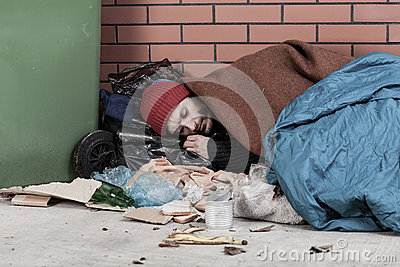 poor-man-sleeping-street-horizontal-40996391